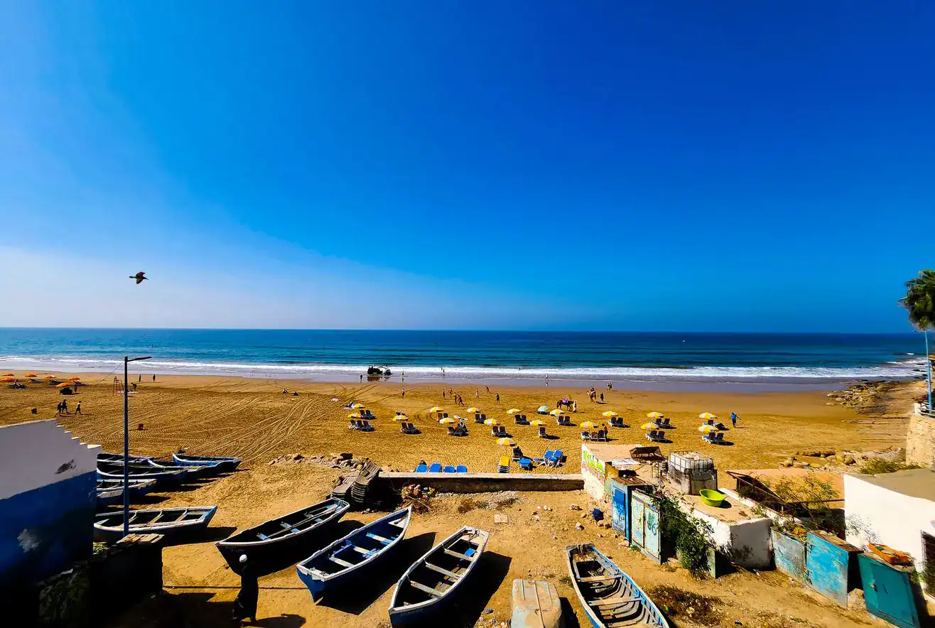 A view of the beach in in Taghazout with boats.